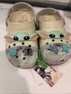 CROCS Kids Cream Clogs with Green Character Accents